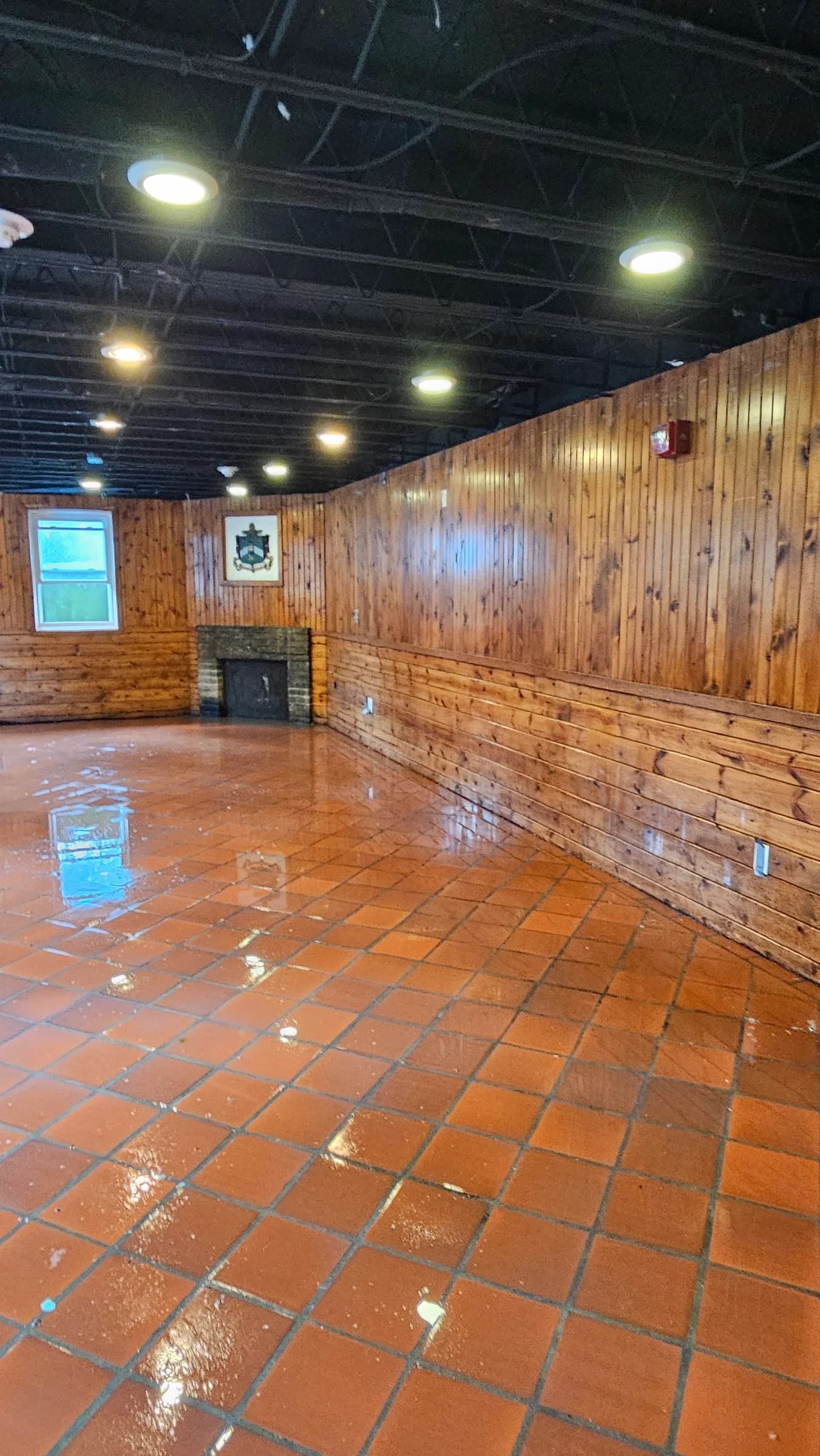 A restored Jackson interior, refinished floor shining under the lights after a SWAT job